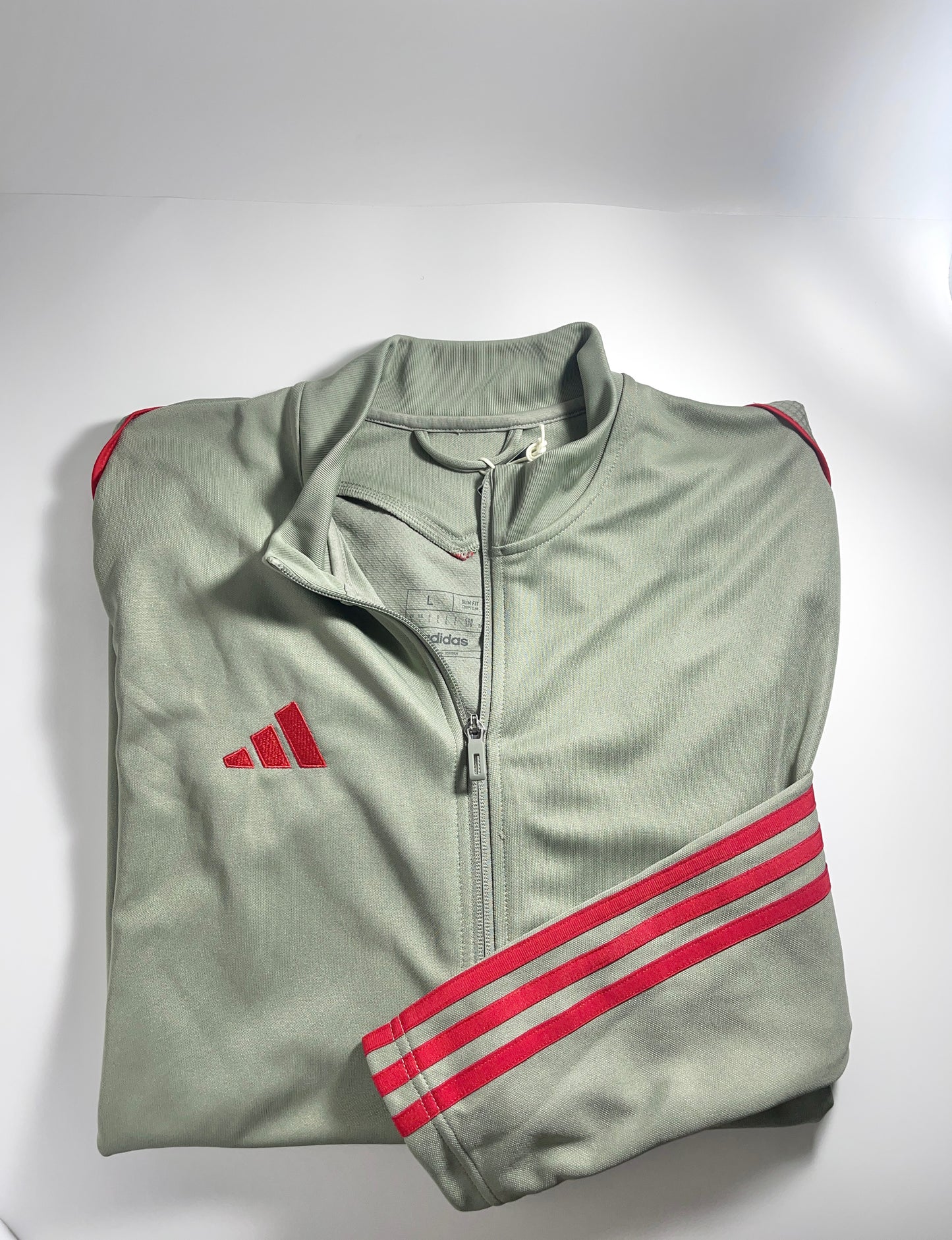 silver green track jacket close up