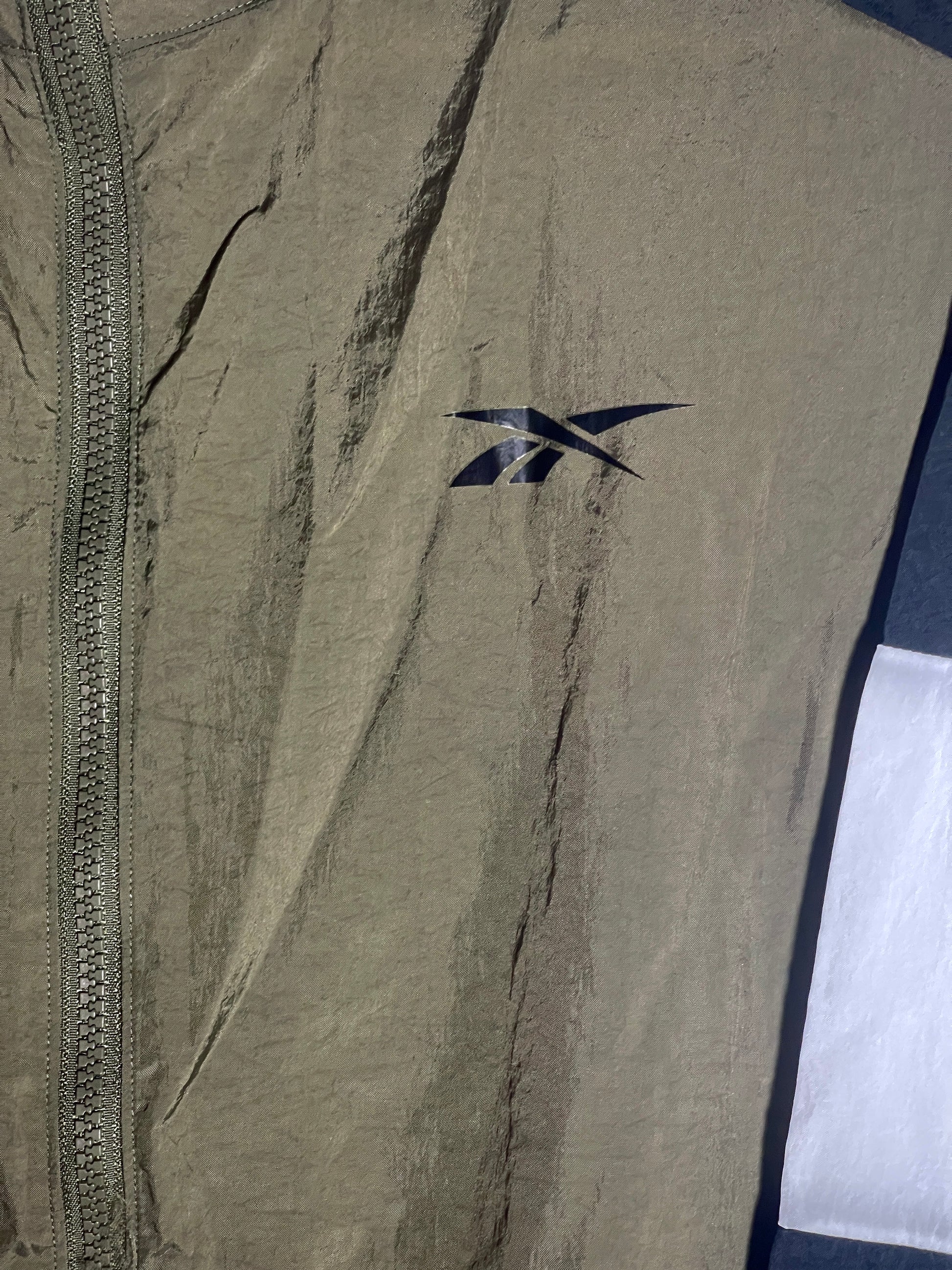 close up, reebok logo on jacket